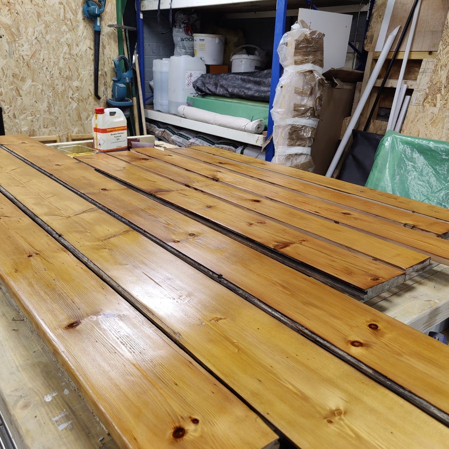 Floorboards finished with shellac in the workshop