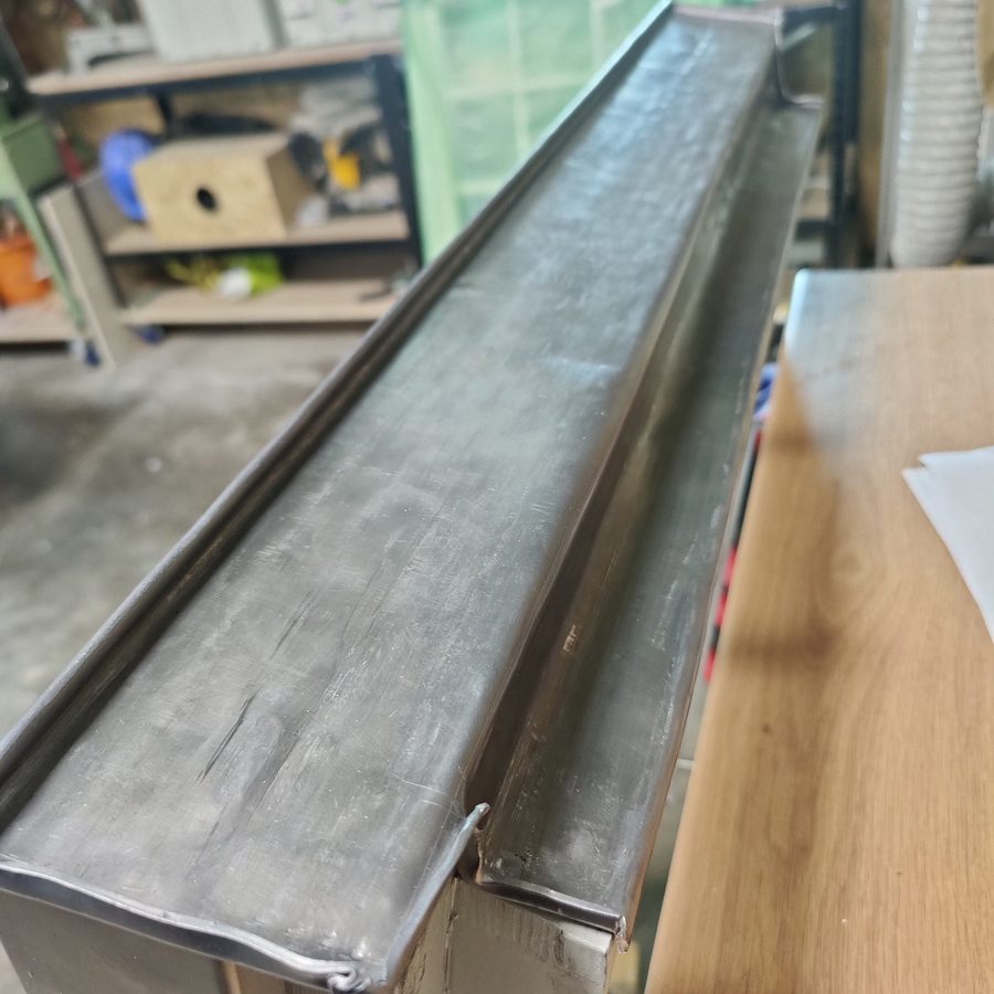Lead weathering formed for a window head