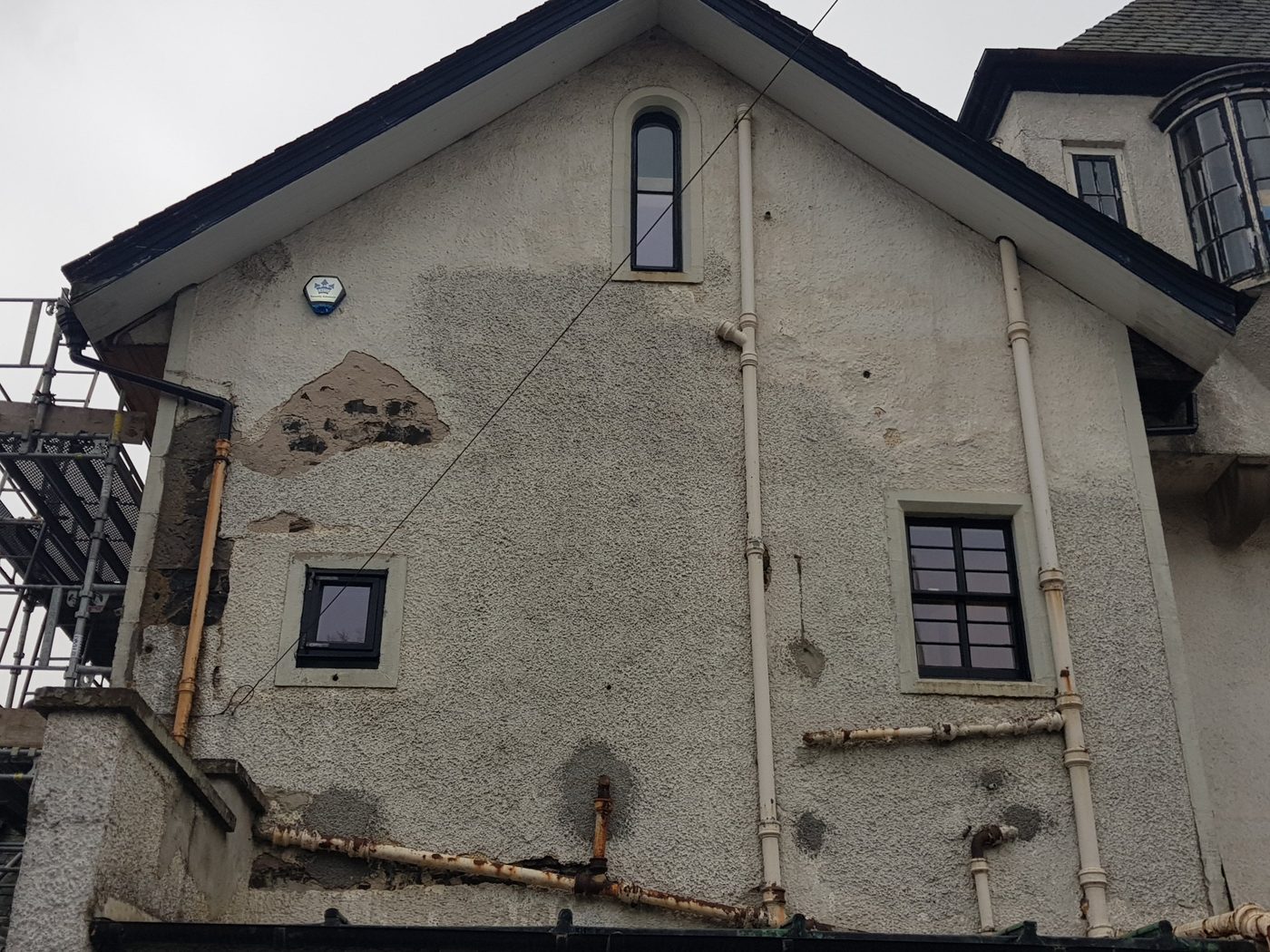 The gable after restoration, with its arched, casement and sash windows reinstalled