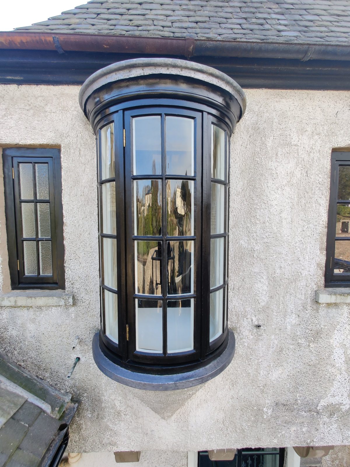 Curved window after restoration with linseed oil