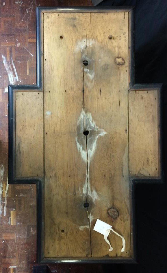 Top of the wooden stand with white water stains and salts around the drainage holes