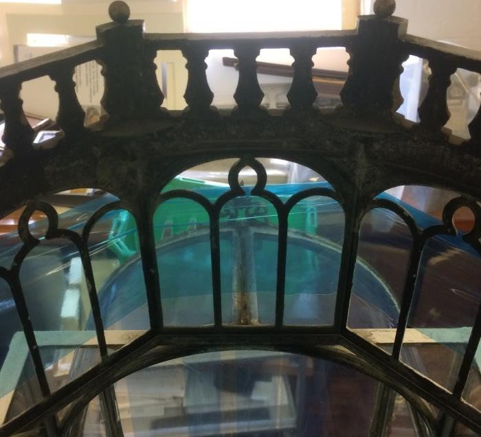 The lantern below the dome with one of its glass panes missing