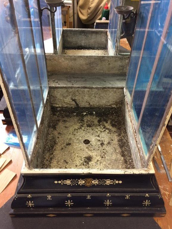 One arm of the case opened with its access panels and lead tray removed